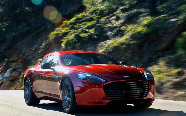 Red car mountain road sunflare free wallpaper for desktop - medium preview image