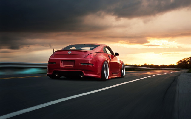 Red sports car driving sunset #2 free wallpaper for desktop - medium preview image