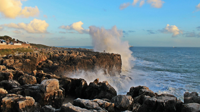 Wave crash rocks boat sailing free wallpaper for desktop - medium preview image