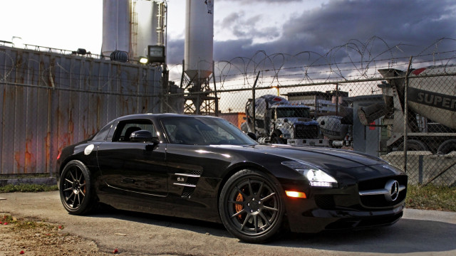 Black sports car fence truck free wallpaper for desktop - medium preview image
