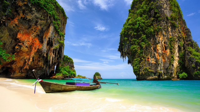 Beach cliffs water boat sky free wallpaper for desktop - medium preview image