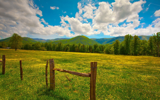Fence mountains clouds green field free wallpaper for desktop - medium preview image