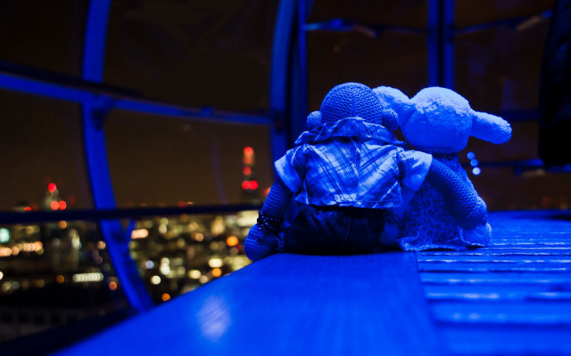 Teddy bear ledge night city free wallpaper for desktop - medium preview image