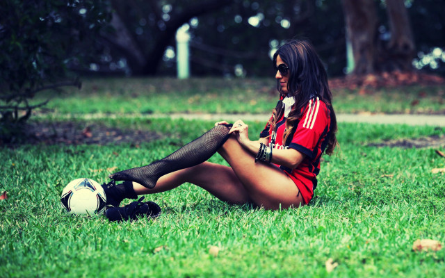Woman sitting grass soccer phone free wallpaper for desktop - medium preview image