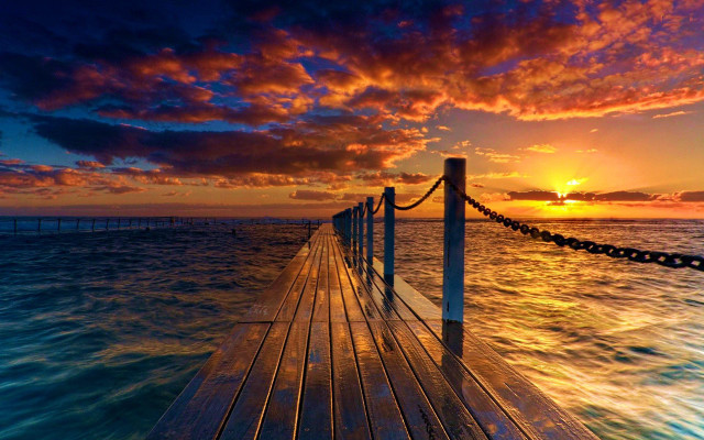 Sunset dock clouds water cityscape free wallpaper for desktop - medium preview image