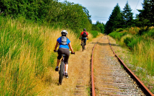 Biking dirt road train tracks free wallpaper for desktop - medium preview image