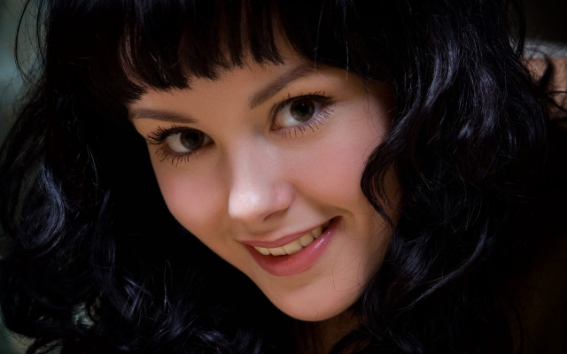 Woman black hair smiling portrait free wallpaper for desktop - medium preview image