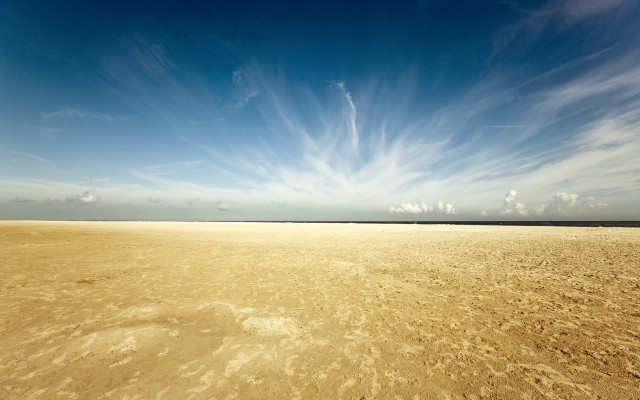 Sandy beach blue sky clouds free wallpaper for desktop - medium preview image