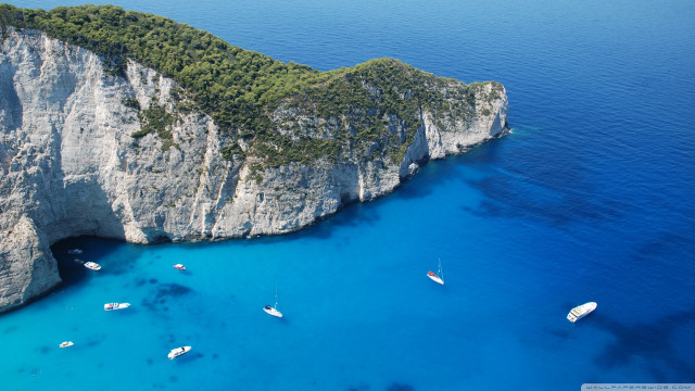 Boats cliff ocean water group free wallpaper for desktop - medium preview image