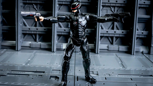 Toy figure cybernetic mecha weapon free wallpaper for desktop - medium preview image