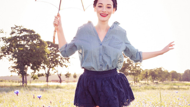 Woman field umbrella smiling outstretched free wallpaper for desktop - medium preview image