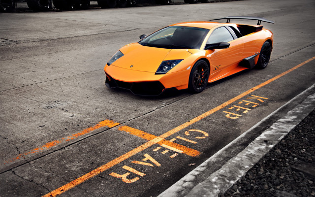 Orange sports car parked yellow free wallpaper for desktop - medium preview image