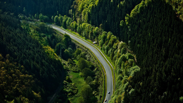 Winding road forest car tiltshift free wallpaper for desktop - medium preview image