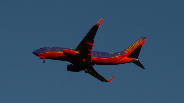 Red blue airplane sky clouds free wallpaper for desktop - medium preview image