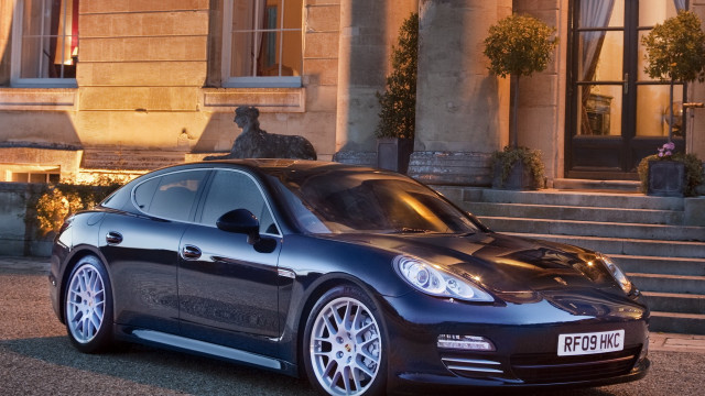 Black car building statue night free wallpaper for desktop - medium preview image