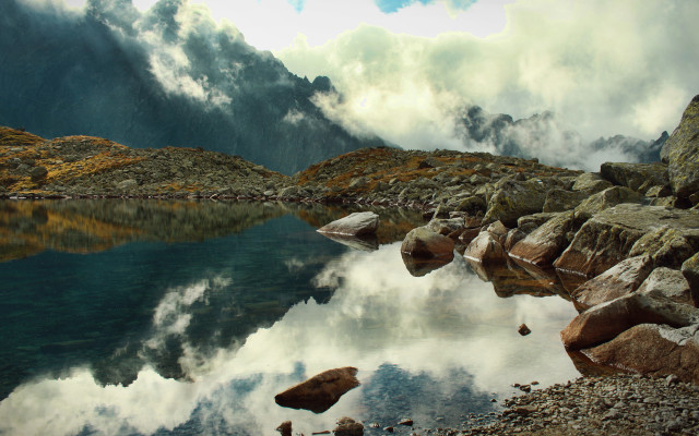 Mountain lake rocks water cloudy free wallpaper for desktop - medium preview image