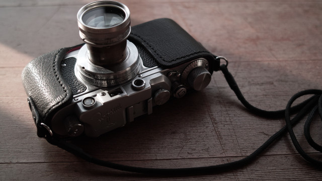 Camera lens table leather case free wallpaper for desktop - medium preview image