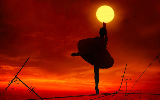 Handstand sunset red sky silhouette free wallpaper for desktop - medium preview image