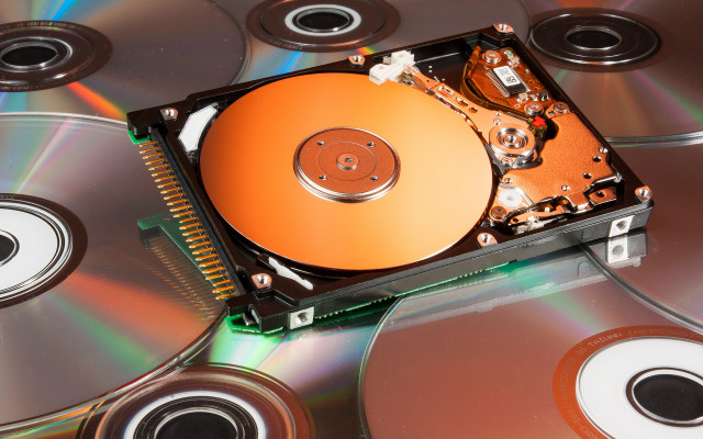Hard drive discs orange technology free wallpaper for desktop - medium preview image