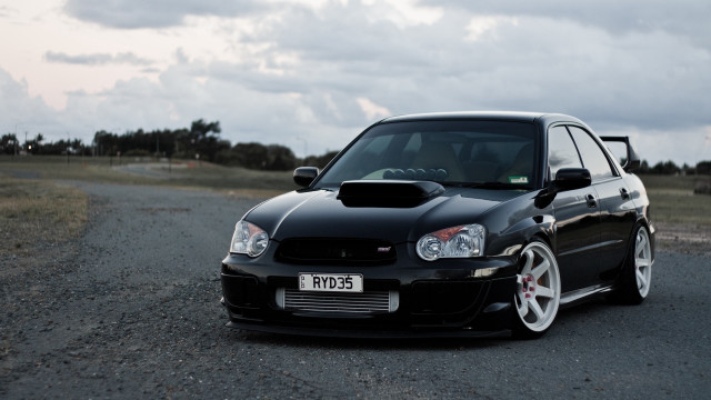 Black car gravel road field #2 free wallpaper for desktop - medium preview image