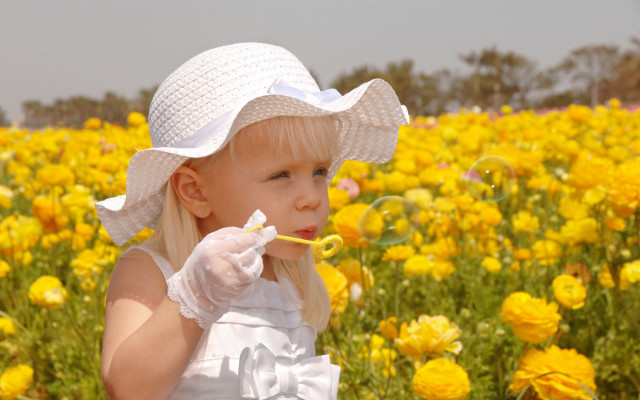 Little girl blowing bubbles yellow free wallpaper for desktop - medium preview image