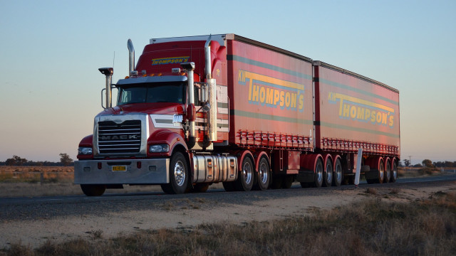 Semi truck desert sunset trailer free wallpaper for desktop - medium preview image