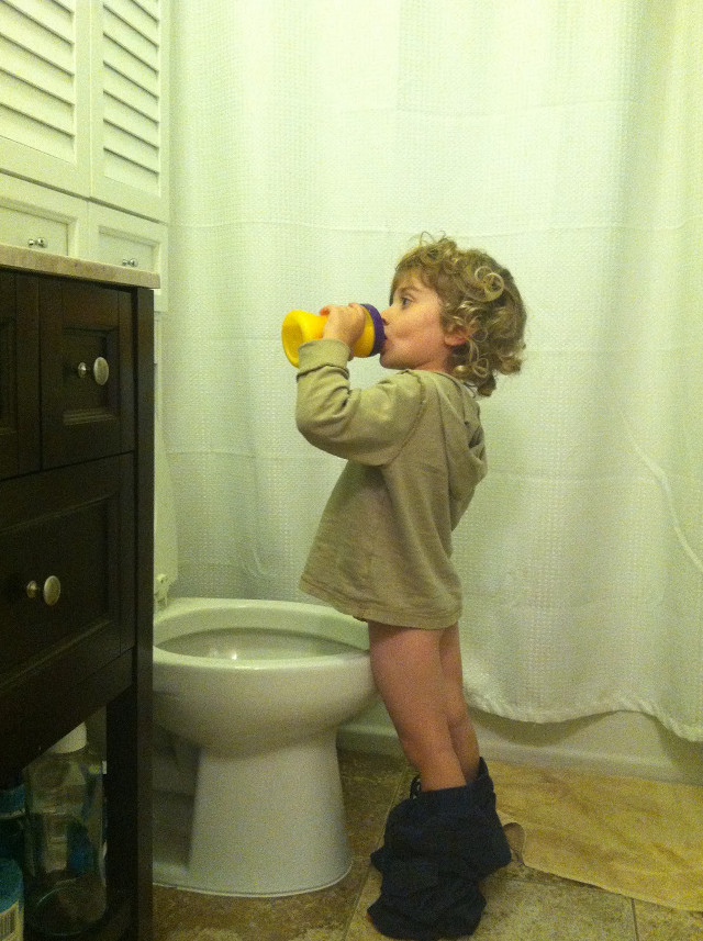 Little girl drinking yellow cup free wallpaper for mobile - medium preview image