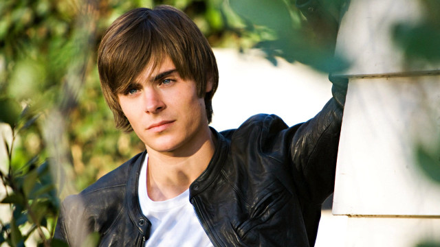 Young man leaning wall serious #2 free wallpaper for desktop - medium preview image