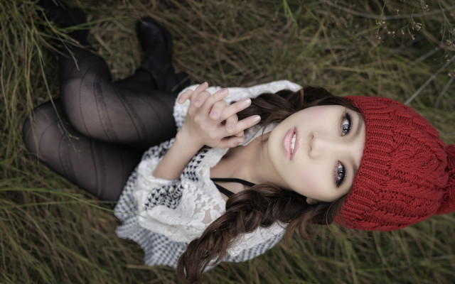 Woman red hat laying grass free wallpaper for desktop - medium preview image