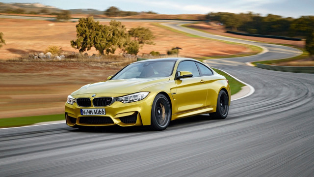 Yellow bmw driving winding road free wallpaper for desktop - medium preview image