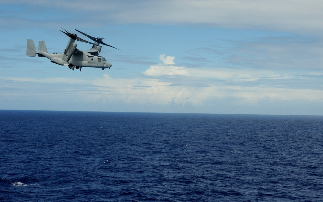 Helicopter ocean clouds boat dock free wallpaper for desktop - medium preview image