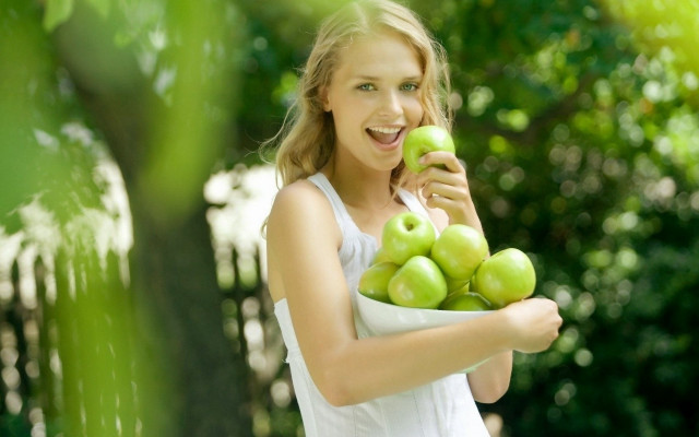 Woman green apples smiling outdoors free wallpaper for desktop - medium preview image
