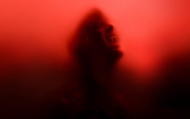 Blurry person red background silhouette free wallpaper for desktop - medium preview image