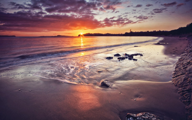 Sunset beach rocks clouds city free wallpaper for desktop - medium preview image