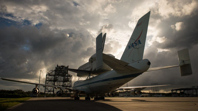 Large airplane tarmac cloudy sky free wallpaper for desktop - medium preview image
