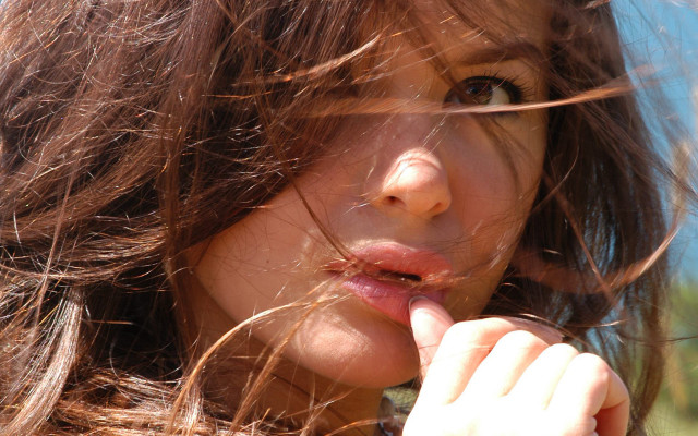 Woman blowing hair cigarette portrait free wallpaper for desktop - medium preview image