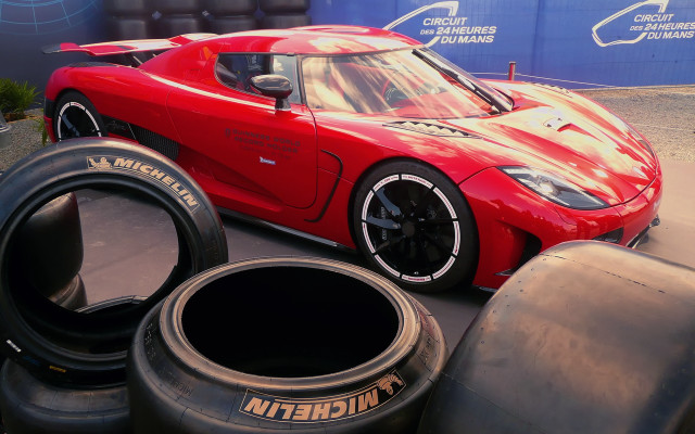 Red sports car tires blue free wallpaper for desktop - medium preview image