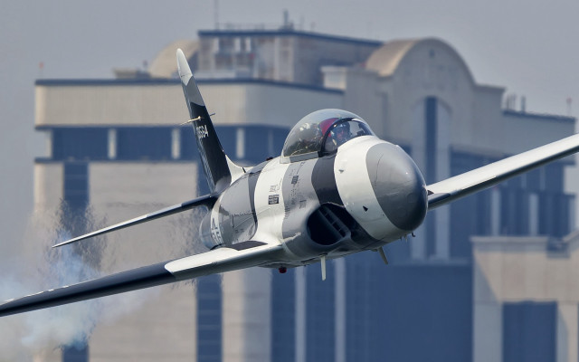 Fighter jet smoke building motion free wallpaper for desktop - medium preview image