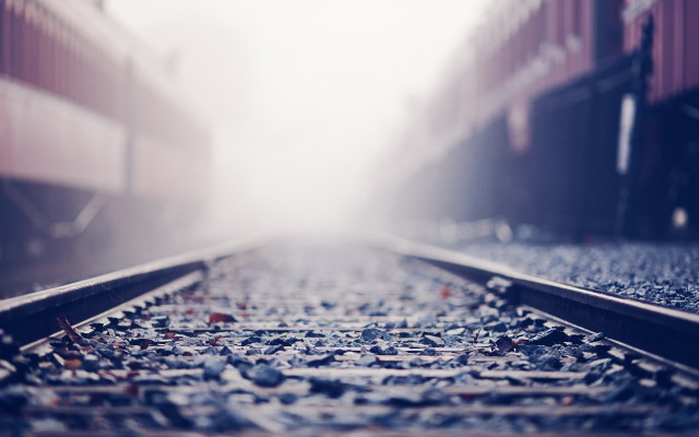 Train track foggy sky tiltshift free wallpaper for desktop - medium preview image