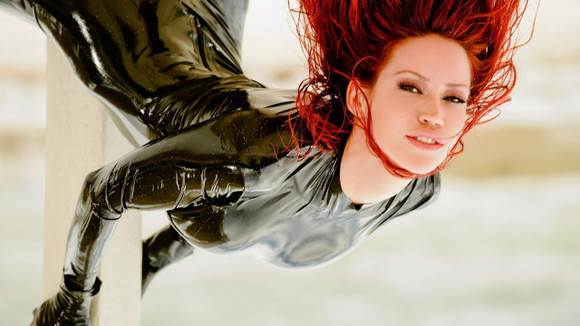 Red haired armor sculpture posing free wallpaper for desktop - medium preview image