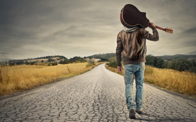 Man walking guitar hat beach free wallpaper for desktop - medium preview image