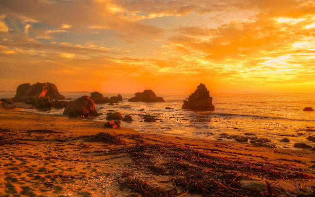 Sunset beach rocks water people free wallpaper for desktop - medium preview image