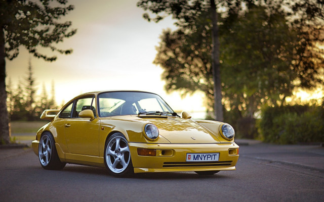 Yellow porsche sunset forest backlit free wallpaper for desktop - medium preview image