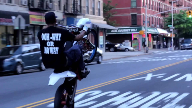 Man motorcycle street tall buildings free wallpaper for desktop - medium preview image