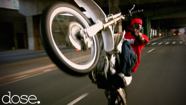 Man riding bike street building free wallpaper for desktop - medium preview image