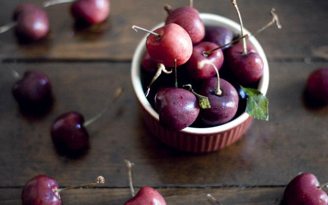 Bowl of plums on wooden free wallpaper for desktop - medium preview image