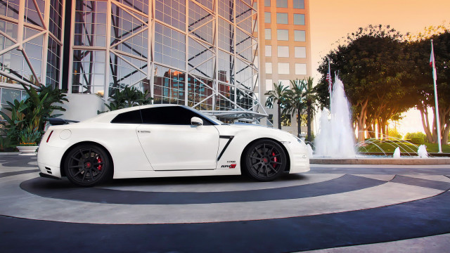 White sports car fountain sunset free wallpaper for desktop - medium preview image