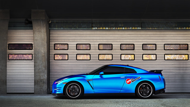 Blue sports car garage door free wallpaper for desktop - medium preview image