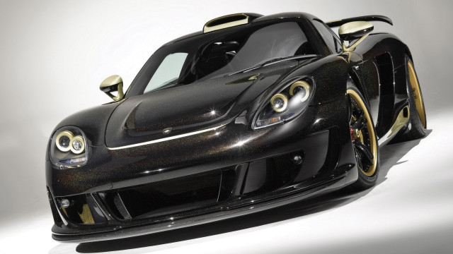 Black gold sports car reflection free wallpaper for desktop - medium preview image