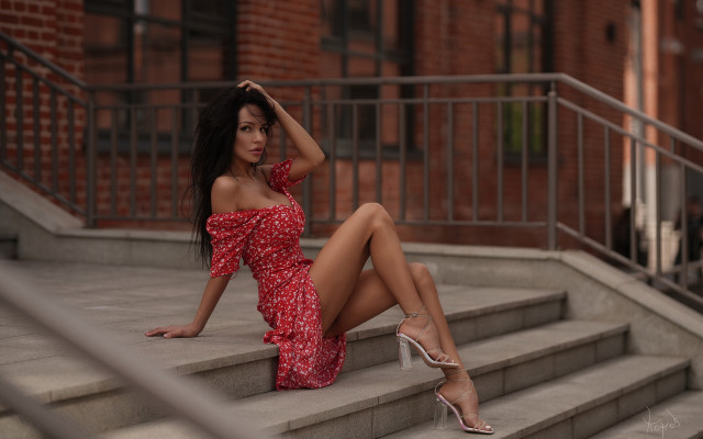 Red dress sitting steps blurry free wallpaper for desktop - medium preview image